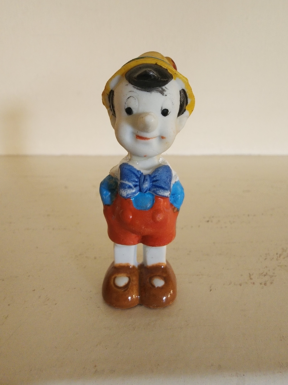 Disney Pinocchio Figurine Toy in Yellow, Blue, Red and Brown
